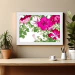 Infidu Vintage Floral Wall Art with pink and red flowers, green leaves, a white background, and a white frame for an elegant and timeless look. displayed on the wall