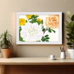 Infidu Vintage Floral Wall Art with yellow, orange, and white roses, green leaves, and a white frame on a white background. displayed on the wall