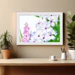 Infidu Vintage Floral Wall Art with white, purple, and pink flowers, green leaves, and a white frame, adding a classic touch to any décor. displayed on the wall