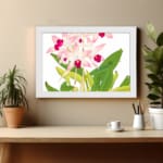 Vintage floral wall art with soft pink orchids, dark pink centers, green leaves, and a white frame on a white background. displayed on the wall