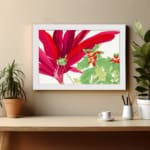 Infidu Vintage Floral Wall Art with large red leaves, green leaves with red accents, and a white frame on a white background. displayed on the wall.