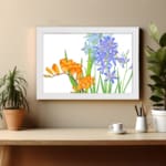 Vintage floral wall art with orange and blue flowers, green leaves, and a white background, framed in white for a classic and elegant look. displayed on the wall