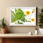 Vintage floral wall art with bright yellow flowers, green leaves, and a white frame on a white background. displayed on the wall