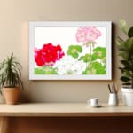 Infidu Vintage Floral Wall Art with red, white, and pink flowers, green leaves, and a white frame on a white background. displayed on the wall