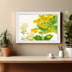 Infidu vintage wall art with bright yellow and pale yellow flowers, green leaves, and a black frame on a white background for an elegant look. displayed on the wall art in a white frame