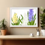 Infidu vintage wall art with yellow, white, and purple flowers, green leaves, and a black frame on a white background for a timeless botanical look. displayed on the wall art in a white frame