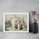 Vintage wall art featuring a polar bear in an icy Arctic landscape with icebergs, explorers, and a soft blue and pink sky. displayed on the wall in a white frame