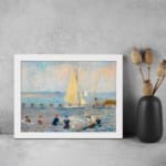 Infidu vintage wall art featuring a peaceful seaside scene with a sailboat on calm waters, people on the beach, and soft pastel colors in the sky. displayed on the wall art in a white frame