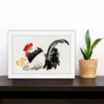 Infidu vintage wall art featuring a traditional-style rooster with two little chicks, set against a white background with bold black, white, red, and yellow tones. displayed on the wall art in a white frame