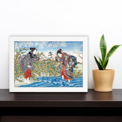 Infidu vintage wall art depicting a traditional Japanese scene with two women in detailed kimonos, a flowing blue river, and blooming trees in soft, earthy tones. displayed on the wall art in a white frame