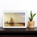 Infidu vintage wall art featuring a peaceful seascape with a large sailboat, warm sunset hues, and distant structures reflected in calm waters. displayed on the wall art in a white frame