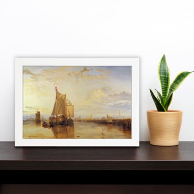 Infidu vintage wall art featuring a peaceful seascape with a large sailboat, warm sunset hues, and distant structures reflected in calm waters. displayed on the wall art in a white frame