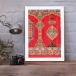 Vintage wall art with intricate red and gold patterns, floral and geometric designs, and a white frame for a timeless, decorative appeal. displayed on the wall