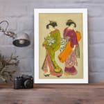 Vintage Japanese wall art with two women in traditional kimonos, featuring rich colors, fine details, and a soft beige background in a white frame. displayed on the wall