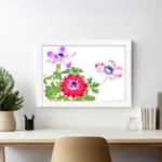 Vintage floral wall art featuring red, pink, and purple flowers with green leaves, framed in white for a classic finish. displayed on the wall