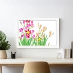 Vintage floral wall art with pink, yellow, and cream flowers and green leaves, framed in white. displayed on the wall