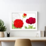 Infidu Vintage Floral Wall Art with red flowers, green leaves, and a white frame on a white background. displayed on the wall