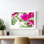 Infidu Vintage Floral Wall Art with pink and red flowers, green leaves, a white background, and a white frame for an elegant and timeless look. displayed on the wall
