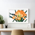 Infidu Vintage Floral Wall Art with bright orange flowers, yellow centers, dark green leaves, and a white frame on a white background displayed on the wall
