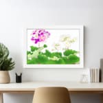 Infidu Vintage Floral Wall Art with pink, purple, and white flowers surrounded by green leaves on a white background, framed in white. displayed on the wall