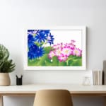 Infidu Vintage Floral Wall Art with deep blue and pink flowers, bright green leaves, a white background, and a white frame for a classic touch. displayed on the wall
