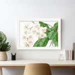 Vintage floral wall art with soft white flowers and green leaves on a white background, framed in white for a classic and elegant touch. displayed on the wall