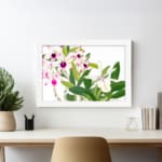 Vintage floral wall art with white and pink orchids, green leaves, and a white frame for an elegant and classic look. displayed on the wall