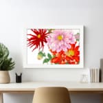 Vintage floral wall art with red, pink, and orange flowers, green leaves, and a white frame on a white background. displayed on the wall