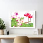 Infidu Vintage Floral Wall Art with pink and red flowers, green leaves, and a white background in a classic vintage design. displayed on the wall in a white frame
