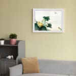 Infidu vintage wall art featuring a detailed botanical design with green leaves, bright yellow flowers, and a delicate dragonfly hovering above, set against a light background. displayed on the wall art in a white frame