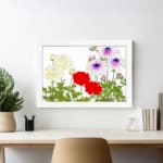Vintage floral wall art with yellow, red, and purple flowers and green leaves on a white background. displayed on the wall
