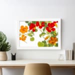 Infidu vintage floral wall art with red and orange flowers, green leaves, and a white frame on a white background. displayed on the wall