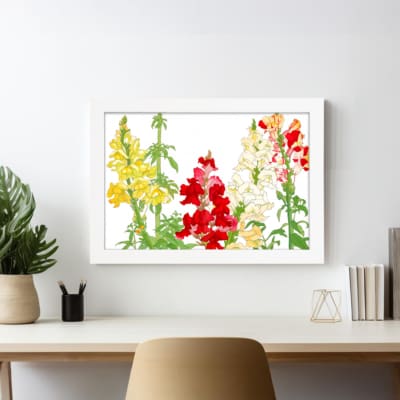 Infidu vintage wall art with tall, colorful flowers in yellow, red, and white with green stems on a white background, adding a vintage touch. displayed on the wall art in a white frame