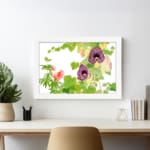 Infidu Vintage Floral Wall Art with deep purple and soft pink flowers, green leaves, and a white frame on a white background. displayed on the wall