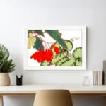 Infidu vintage wall art with bright red flowers, large green leaves, and a white frame on a white background for a classic and elegant look. displayed on the wall