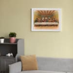 Vintage wall art of the Last Supper with Jesus and his disciples in a detailed, warm-toned biblical setting. displayed on the wall in a white frame
