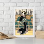 Vintage wall art of a Japanese woman in a black kimono with floral sash, standing before a traditional wooden building. displayed on the wall in a white frame