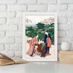 Vintage Japanese wall art of women in kimonos under cherry blossom trees with a temple in the background, displayed on the wall in a white frame