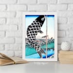 Infidu vintage wall art featuring a black koi fish hanging on a pole with intricate scales, set against a traditional Japanese landscape with a blue sky, serene water, and a classic bridge. displayed on the wall art in a white frame