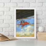 Infidu vintage wall art featuring a red airplane soaring through a bright blue sky with white clouds, evoking a sense of adventure and exploration. displayed on the wall art in a white frame