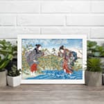 Infidu vintage wall art depicting a traditional Japanese scene with two women in detailed kimonos, a flowing blue river, and blooming trees in soft, earthy tones. displayed on the wall art in a white frame