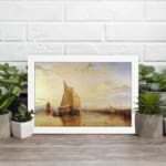 Infidu vintage wall art featuring a peaceful seascape with a large sailboat, warm sunset hues, and distant structures reflected in calm waters. displayed on the wall art in a white frame