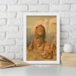 Vintage wall art of a majestic lion family in a natural setting with warm earthy tones, including a lion, lioness, and cubs in a savannah backdrop. displayed on the wall in a white frame