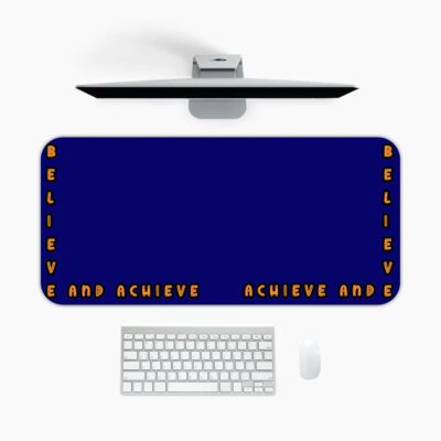 Infidu blue desk pad with “Believe and Achieve” quote in bold orange text on a deep blue background.
