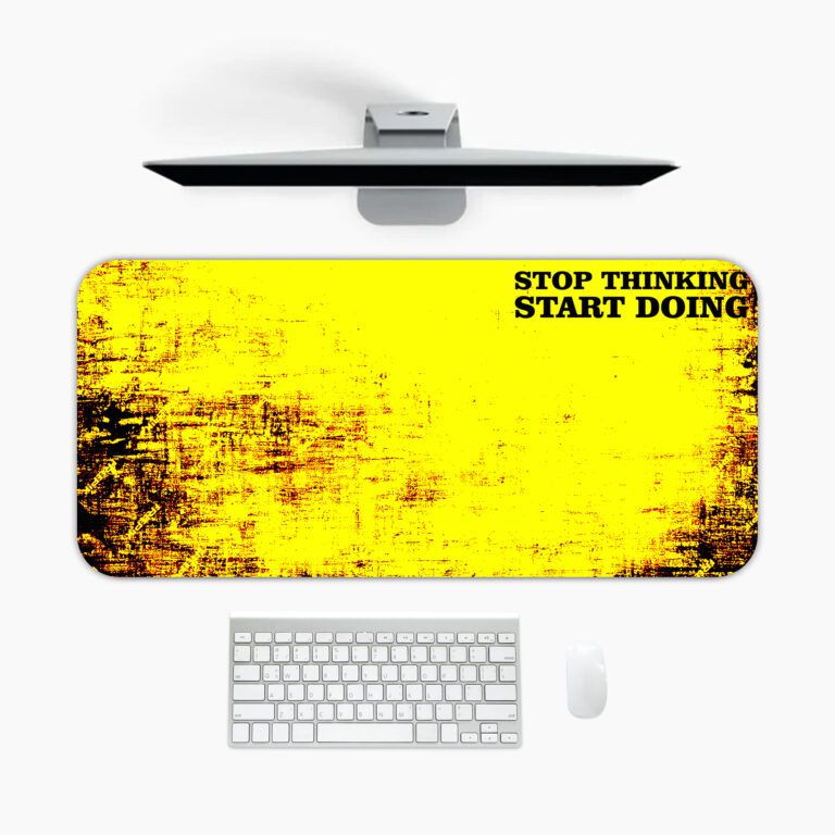 Infidu bold yellow desk pad with black grunge edges and motivational quote “STOP THINKING START DOING” in a vintage art style.