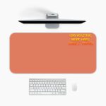 Infidu terracotta desk pad with bold motivational quote in yellow and red on warm orange background, minimalistic vintage art design.