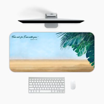 Infidu beach desk pad with tropical leaves and Isaiah 41:10 Bible verse on a soft sky and sand background.