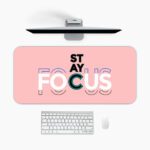 Infidu pastel pink desk pad with bold “STAY FOCUS” quote in colorful typography