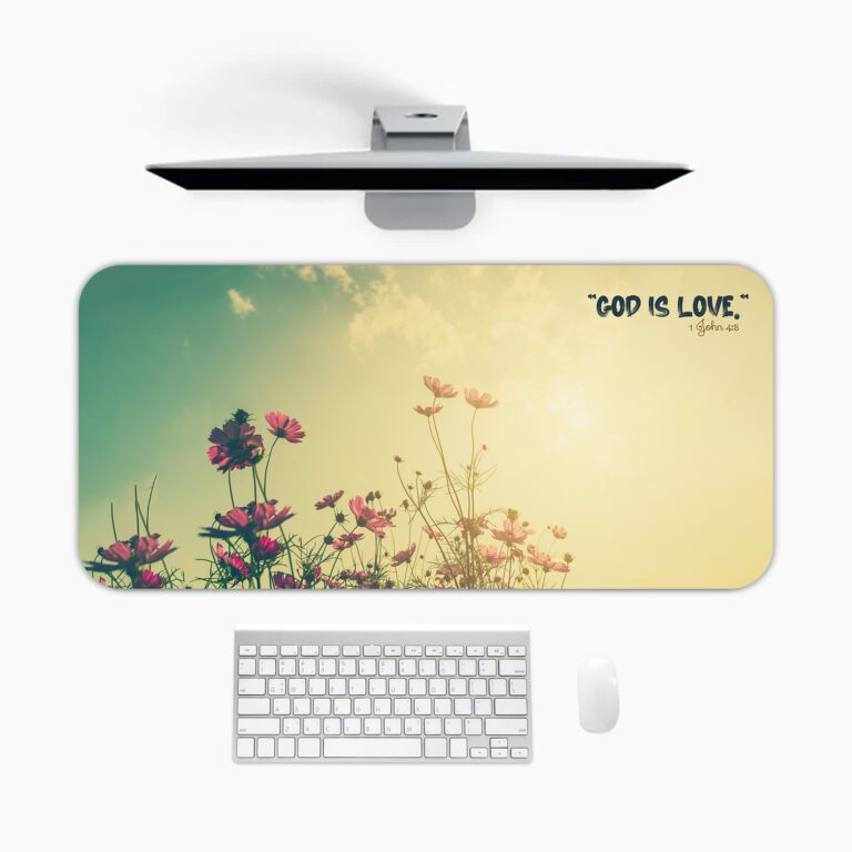 Vintage-style desk pad with wildflowers, sunrise background, and the quote “GOD IS LOVE” in black font.