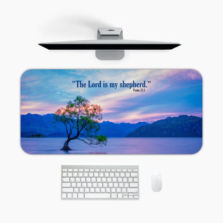 Scenic desk pad with Bible verse and serene lake, tree, and pastel sky design.